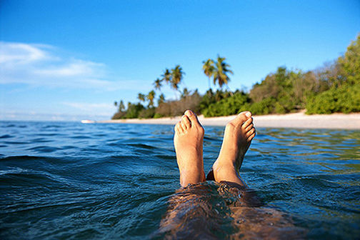 Man's leg sticking out of water